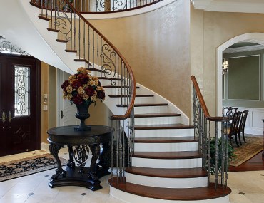 Circular staircase luxury home foyer