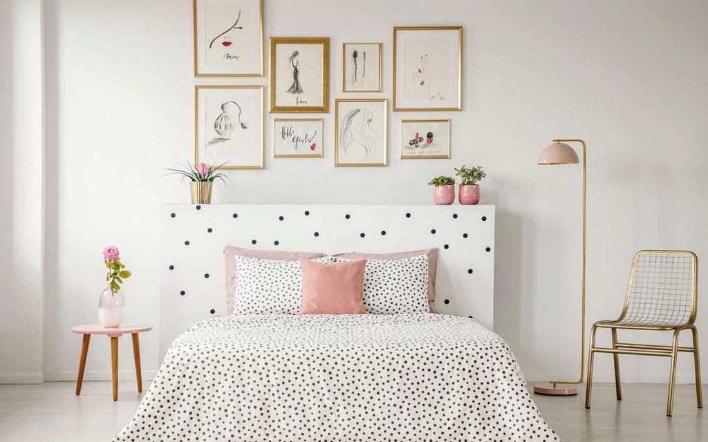 create a gallery wall above the bed