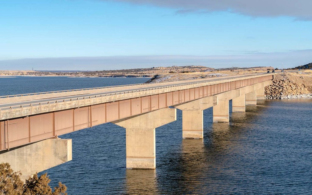 A beam bridge probably has the simplest structure